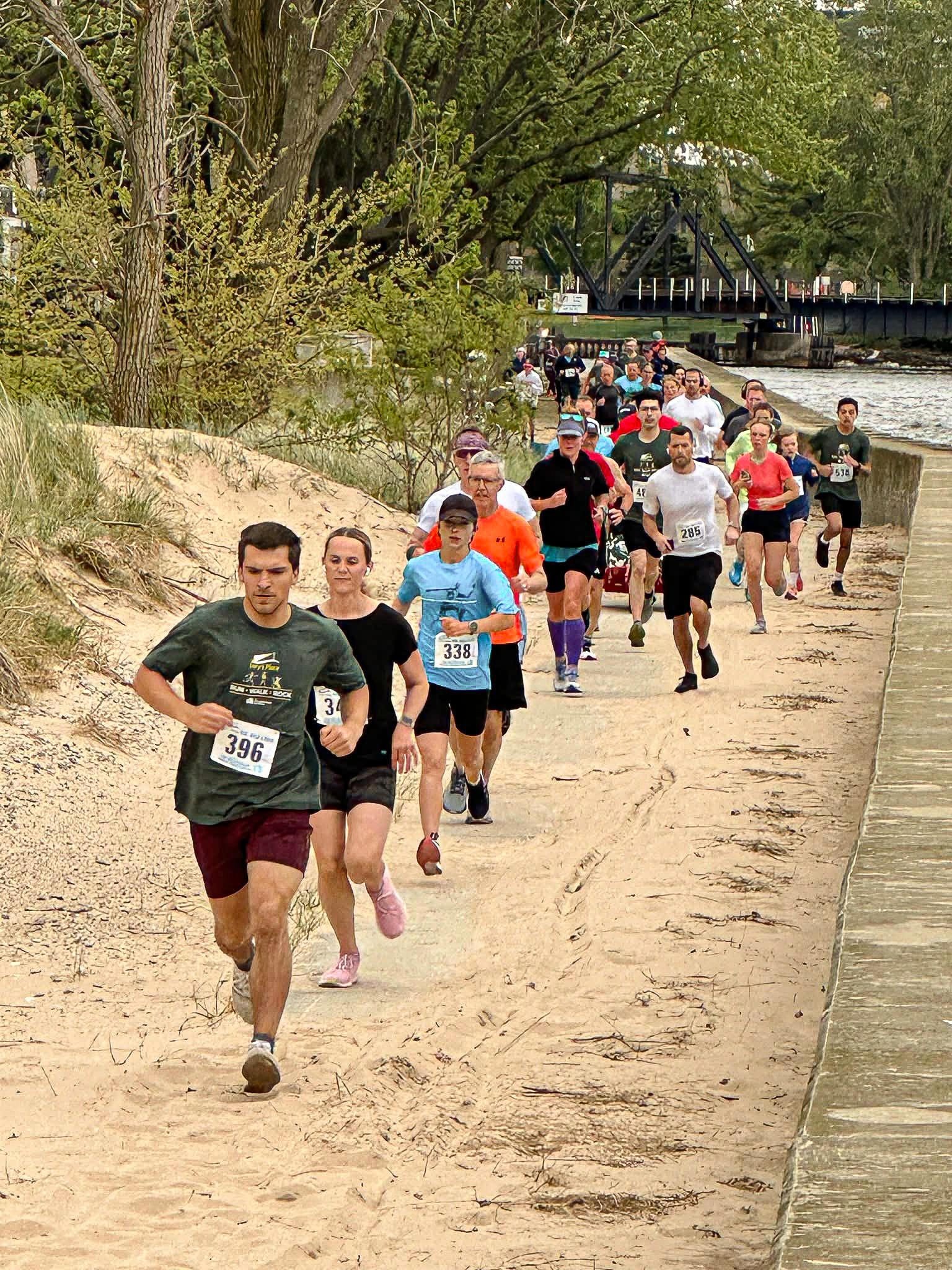 Group of people running on a beach