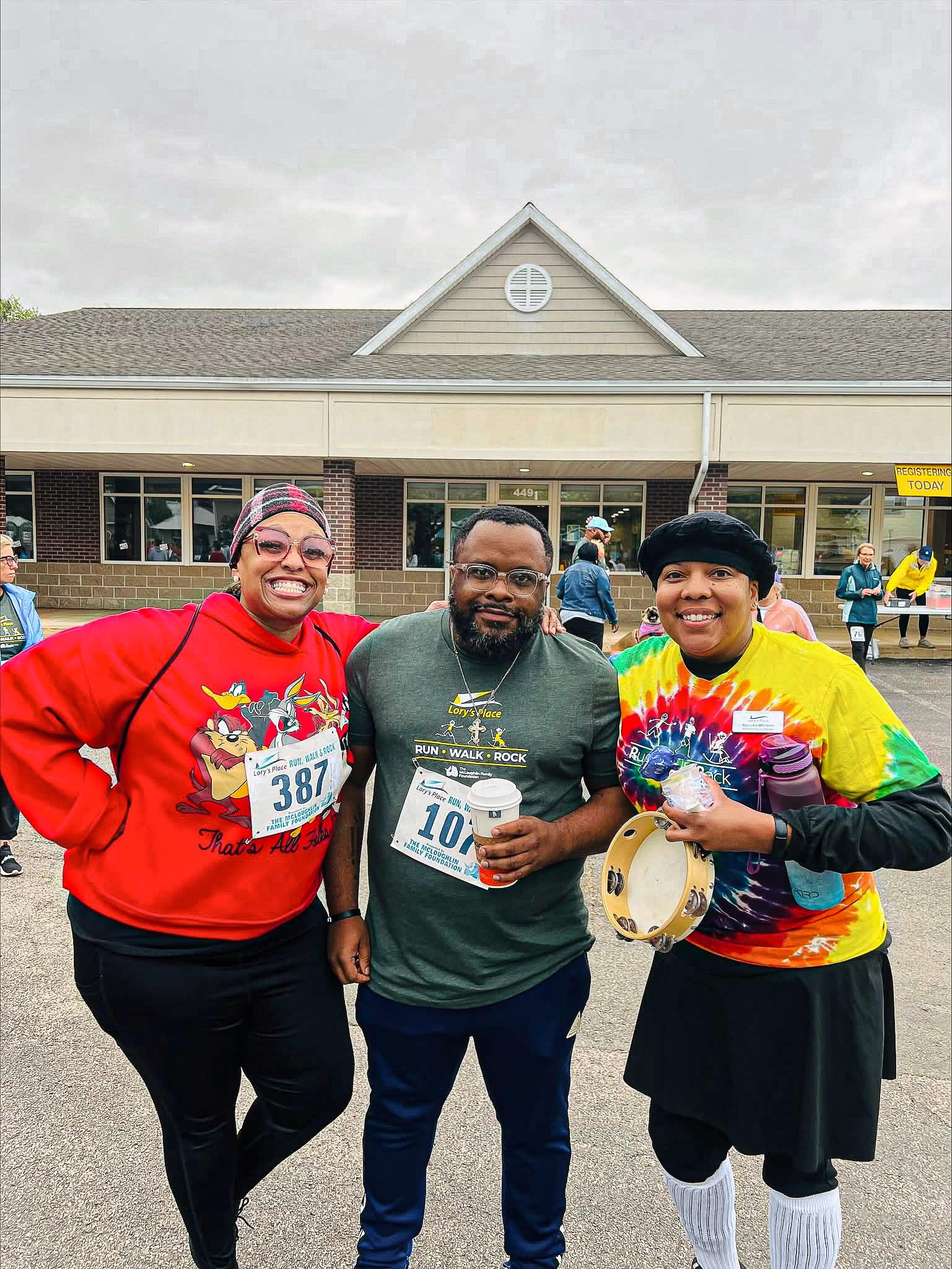 Three runners looking happy